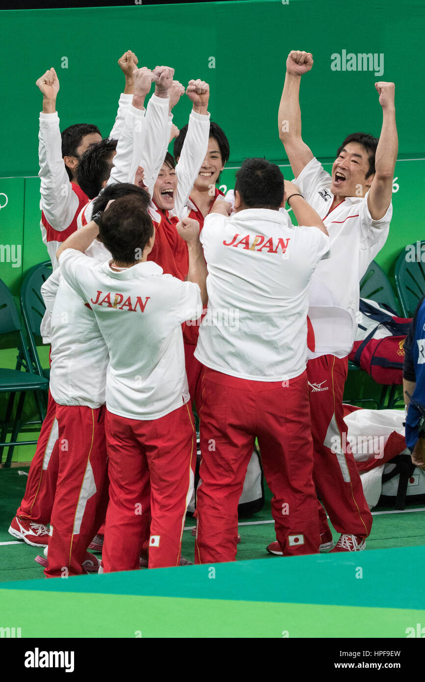 Rio de Janeiro, Brazil. 8 August 2016. Japanese Men's Gymnastics Team celebrates winning the gold medal at the 2016 Olympic Summer Games. ©Paul J. Sut Stock Photo
