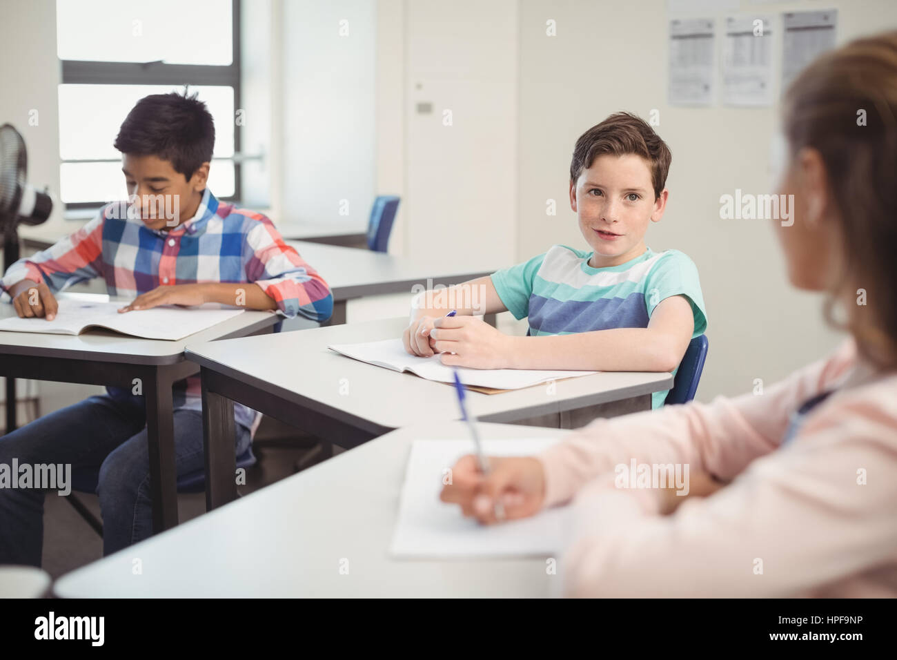 Students studying in classroom at school Stock Photo - Alamy