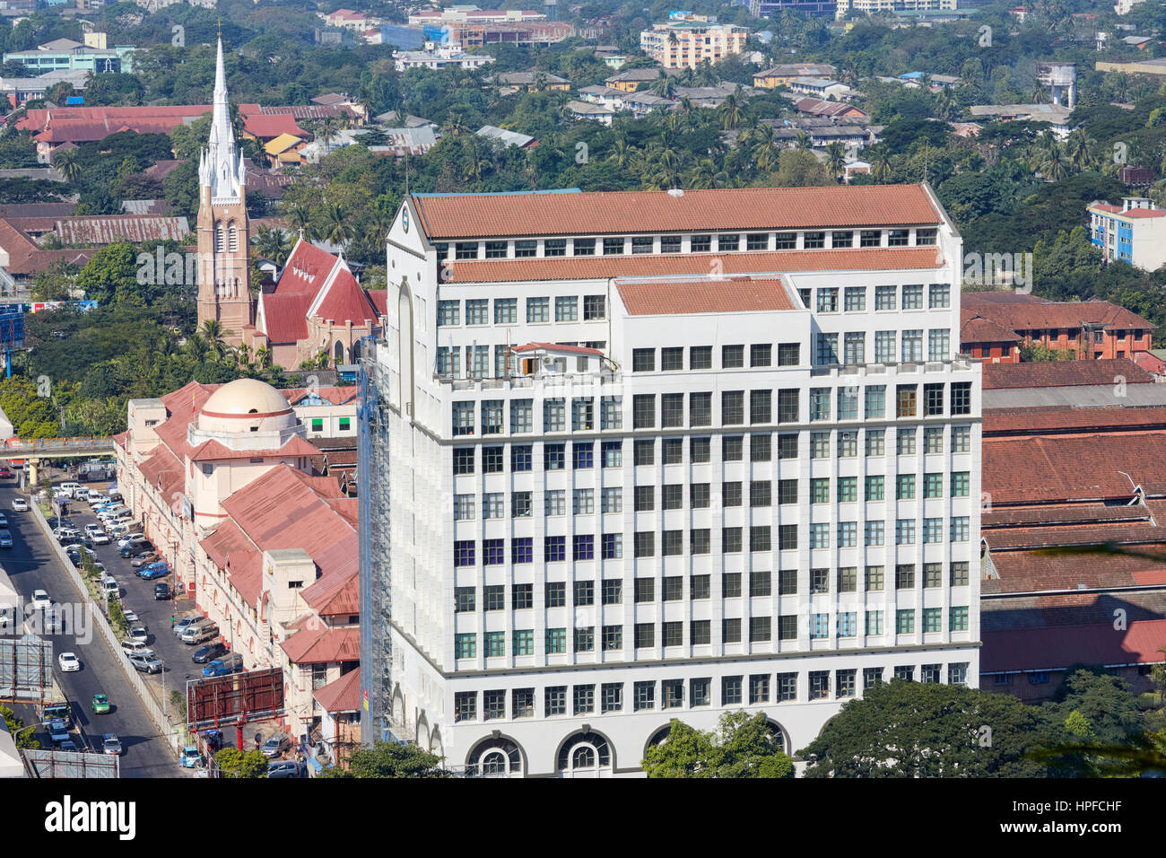 FMI Building and the Holy Trinity Anglican Church on Bogyoke Road, Yangon, Myanmar Stock Photo