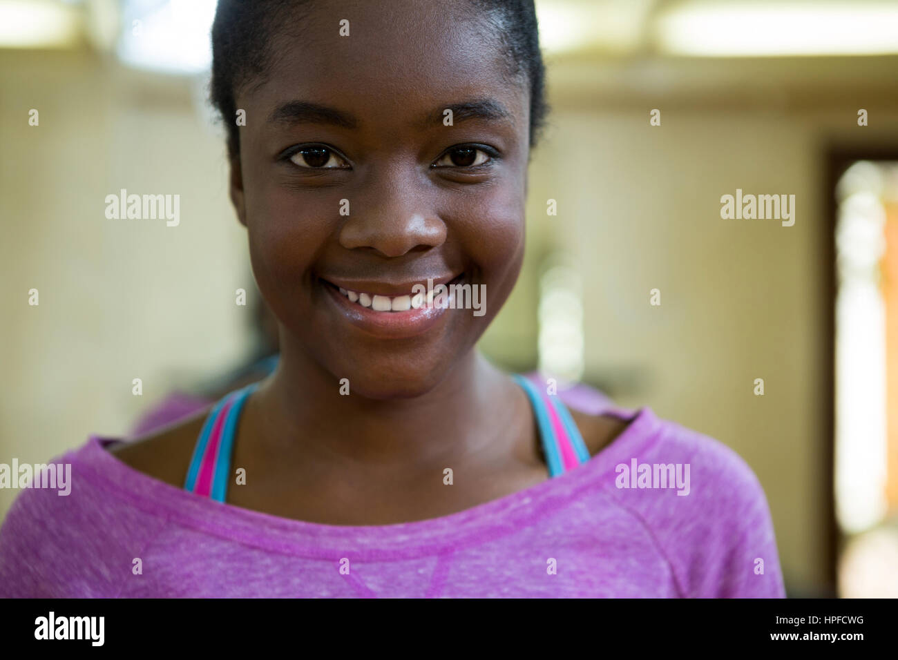 Portrait of smiling fit woman in fitness studio Stock Photo - Alamy