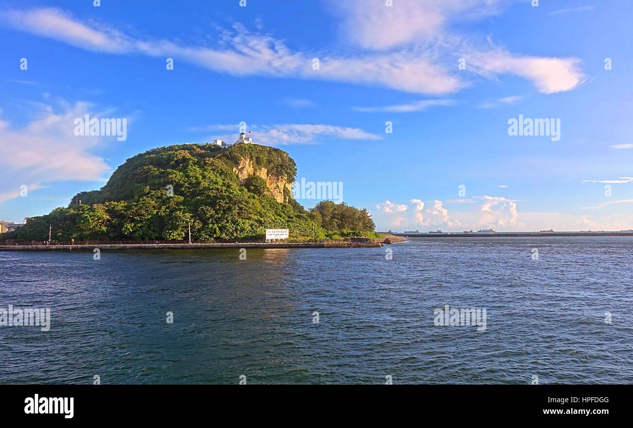 KAOHSIUNG, TAIWAN -- JULY 4, 2016: A view of the historic lighthouse on the island of Chijin marking the entrance to Kaohsiung Harbor. Stock Photo