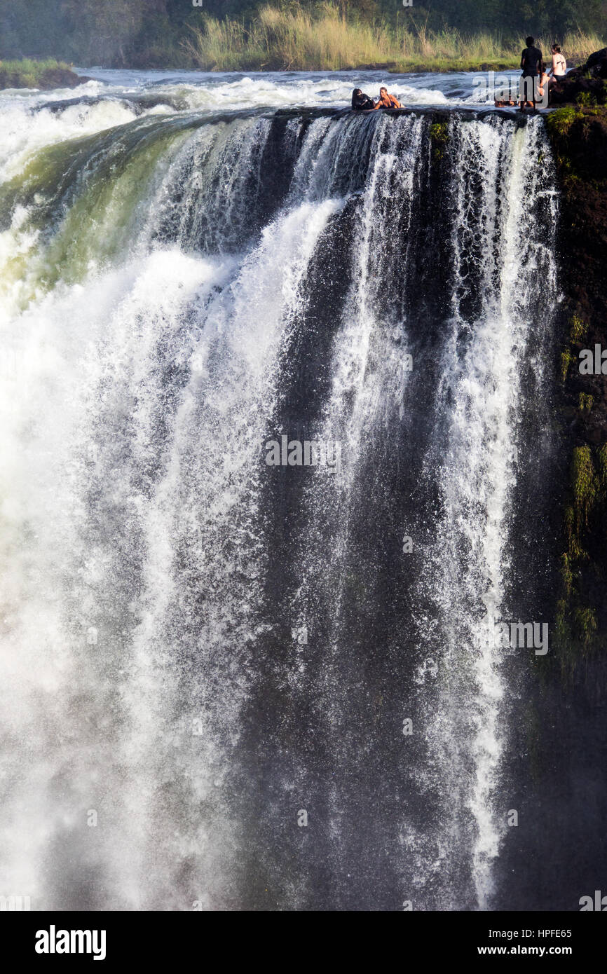 Tourists in Devil's Pool, Victoria Falls, Zambia Stock Photo