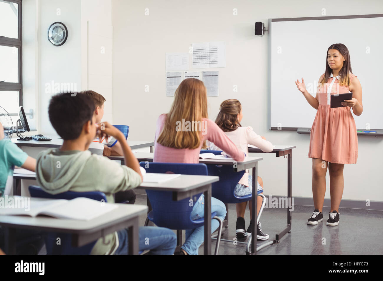 Schoolgirl giving presentation in classroom at school Stock Photo Alamy