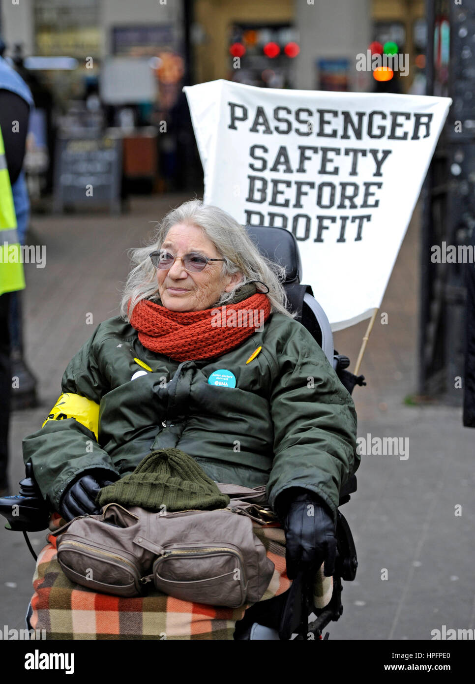 Brighton, UK. 22nd Feb, 2017. Miriam Binder from Disabled People Against Cuts with members of the RMT union on the picket line outside Brighton Railway Station this morning on another day of strike action in the dispute between the management and the unions over driver only trains . The long running dispute which has caused travel disruption in the south east is over Southern Rail management wanting to get rid of conductors on the trains Credit: Simon Dack/Alamy Live News Stock Photo