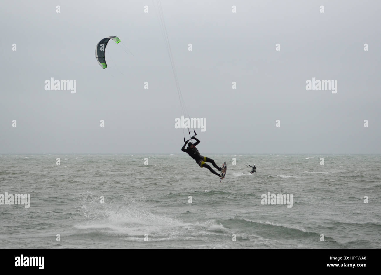 Kite surfers in strong wind on the south coast as Storm Doris approaches the UK. Gale to storm force winds are expected over much of the country. Bournemouth, Dorset, UK. 22nd Feb, 2017 Stock Photo