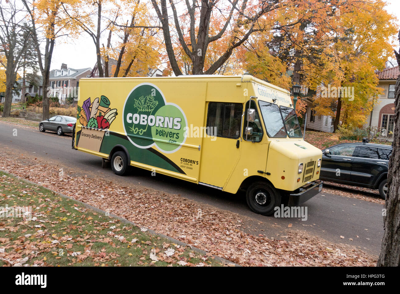 Coborns Delivers yellow truck making a residential grocery delivery. St Paul Minnesota MN USA Stock Photo