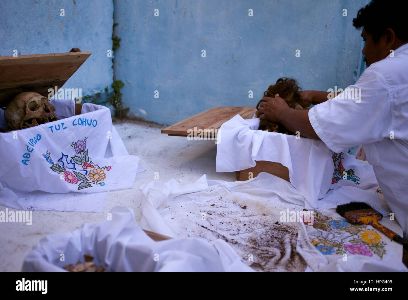 A Man Cleans The Bones Of A Deceased Person In The Mayan Village Of 