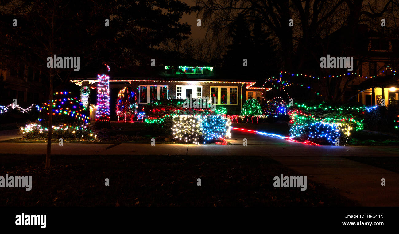 House and yard decorated with colorful Christmas lights along Summit Avenue. St Paul Minnesota
