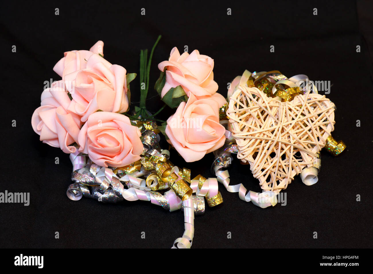 pink roses and a heart to show the concept of love and marriage Stock ...