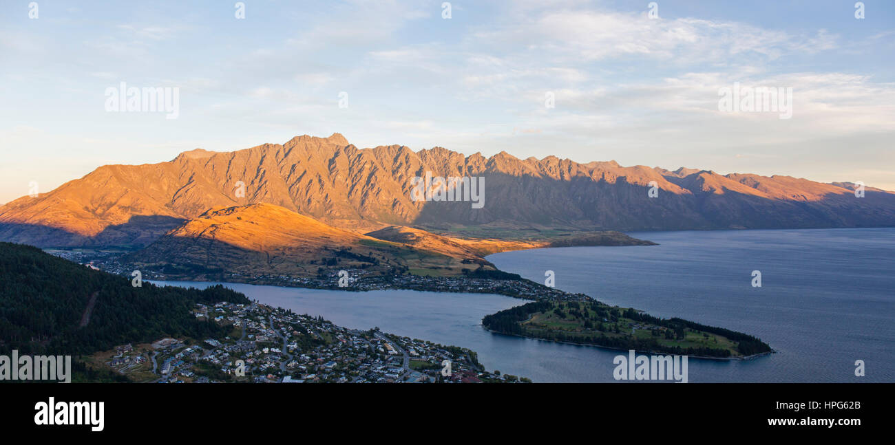 Queenstown, Otago, New Zealand. Panoramic view from the Skyline Gondola station to Lake Wakatipu and the Remarkables, sunset. Stock Photo