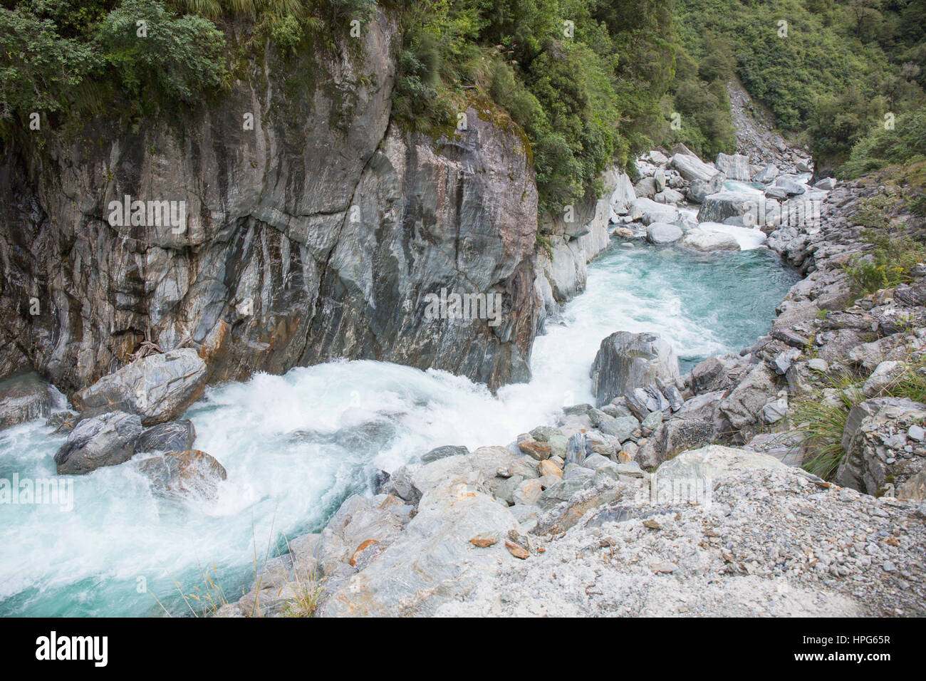Haast Pass, Mount Aspiring National Park, West Coast, New Zealand. The foaming waters of the Haast River plunging downstream at the Gates of Haast. Stock Photo