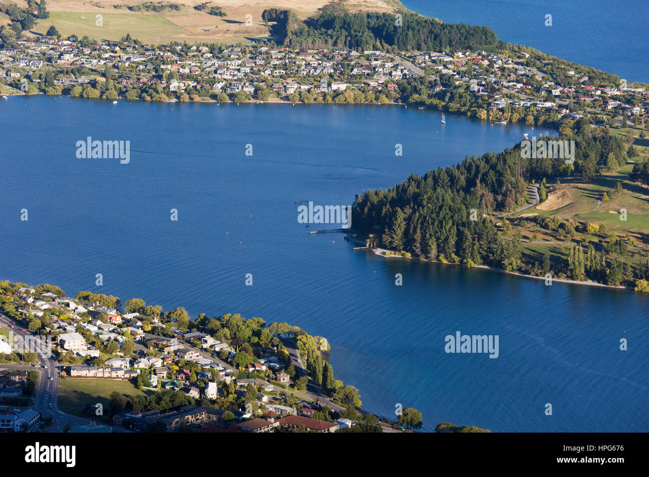 Queenstown, Otago, New Zealand. View over Frankton Arm, an inlet of Lake Wakatipu, to the exclusive suburb of Kelvin Heights. Stock Photo