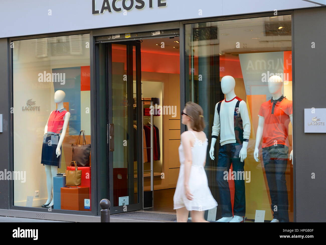 France, Paris 15th district, Woman in front of a Lacoste shop on Rue du  Commerce Stock Photo - Alamy