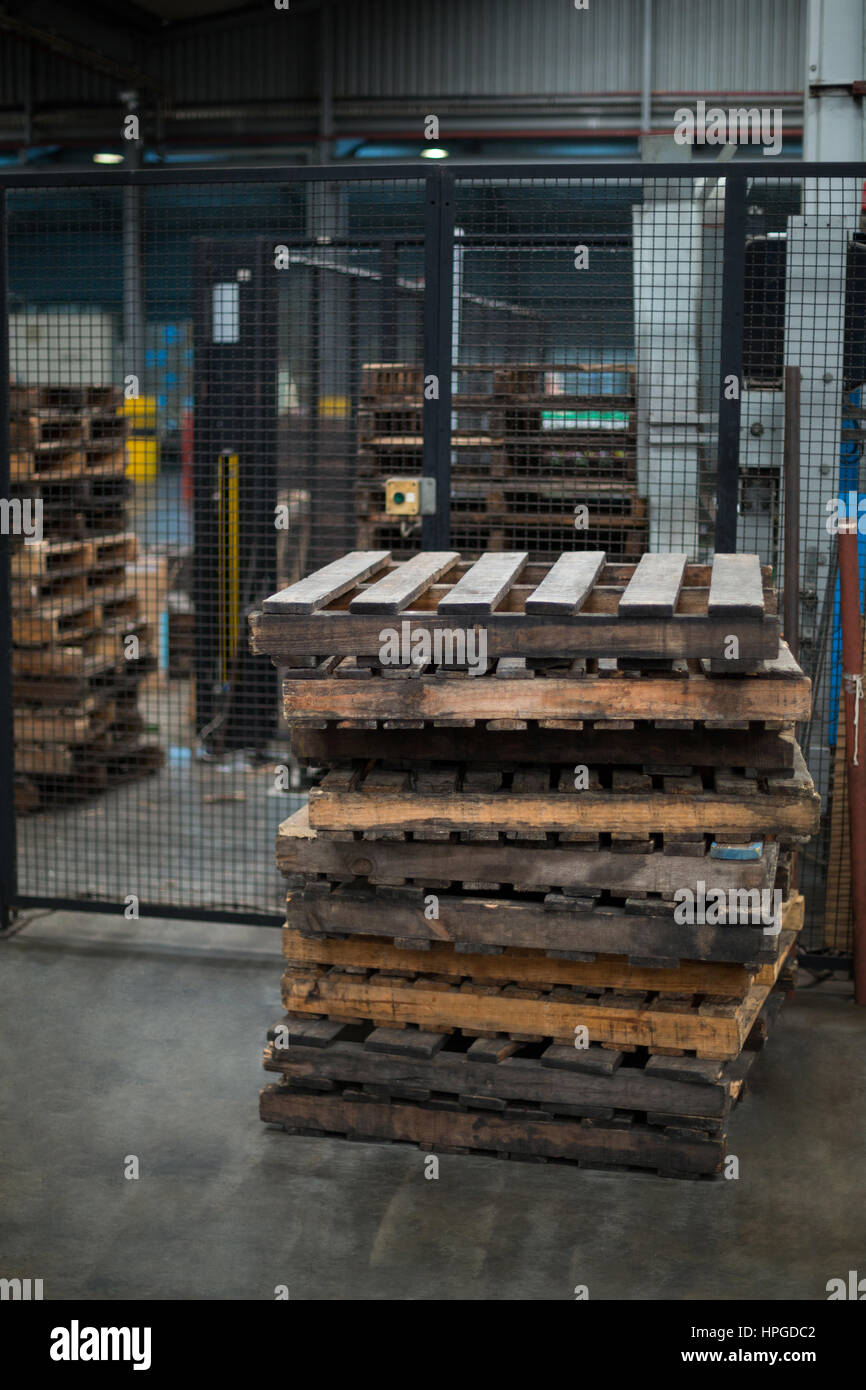 Stack of wooden pallets in bottle factory Stock Photo