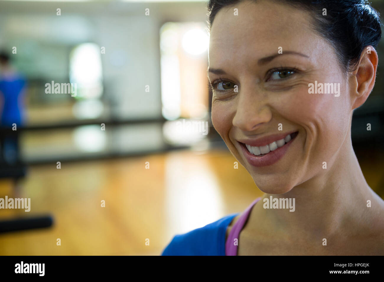 Portrait of smiling fit woman in gym Stock Photo - Alamy