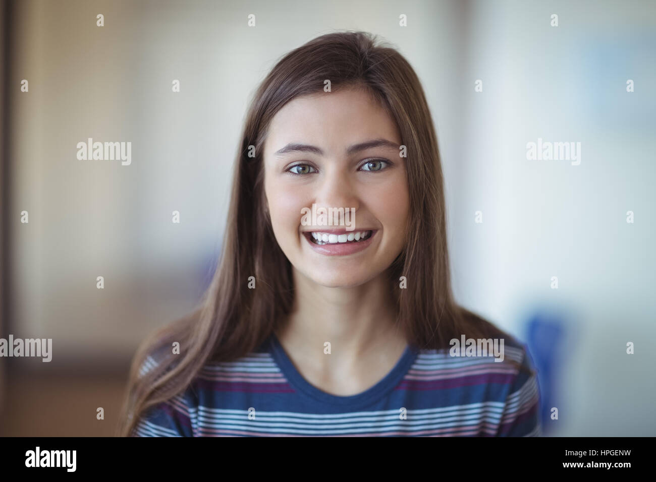 Portrait of smiling schoolgirl in school Stock Photo - Alamy
