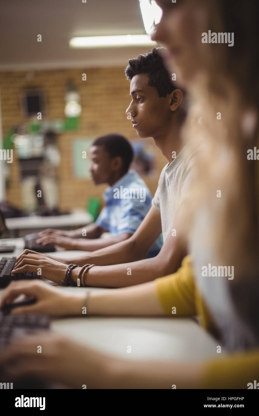 Schoolboy studying in computer classroom at school Stock Photo - Alamy