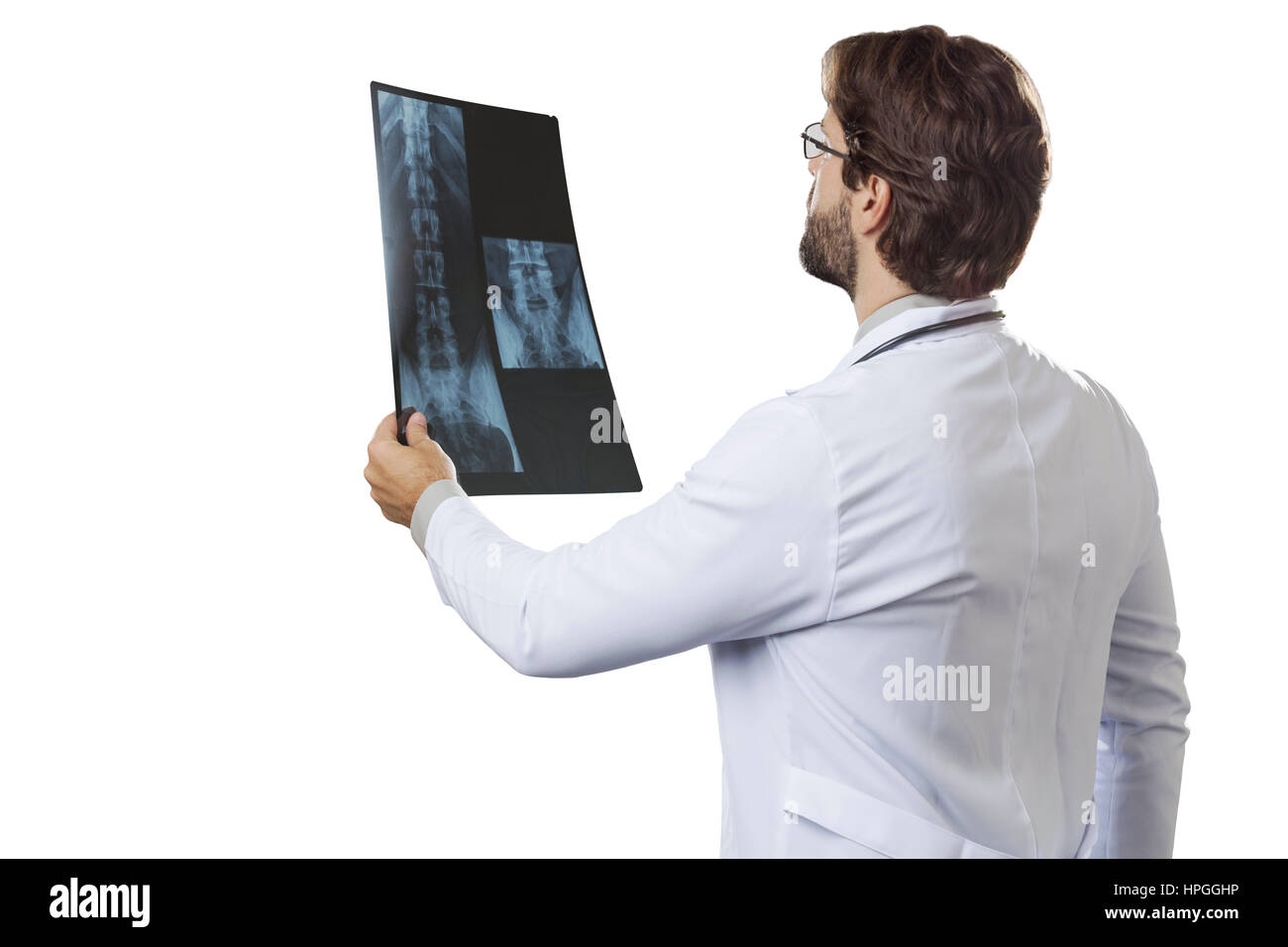 Male doctor looking at a x-Ray on a White background Stock Photo - Alamy