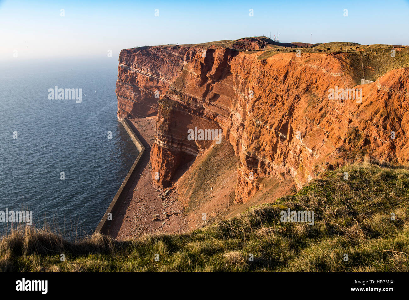 The red steep coast line of Helgoland, an German Island in the North Sea, Stock Photo