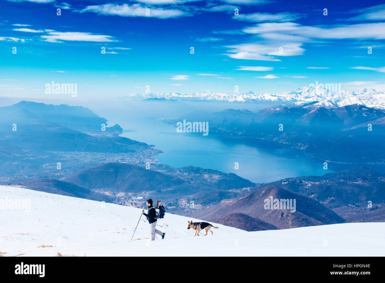 hiker with dog on the mountain Stock Photo - Alamy
