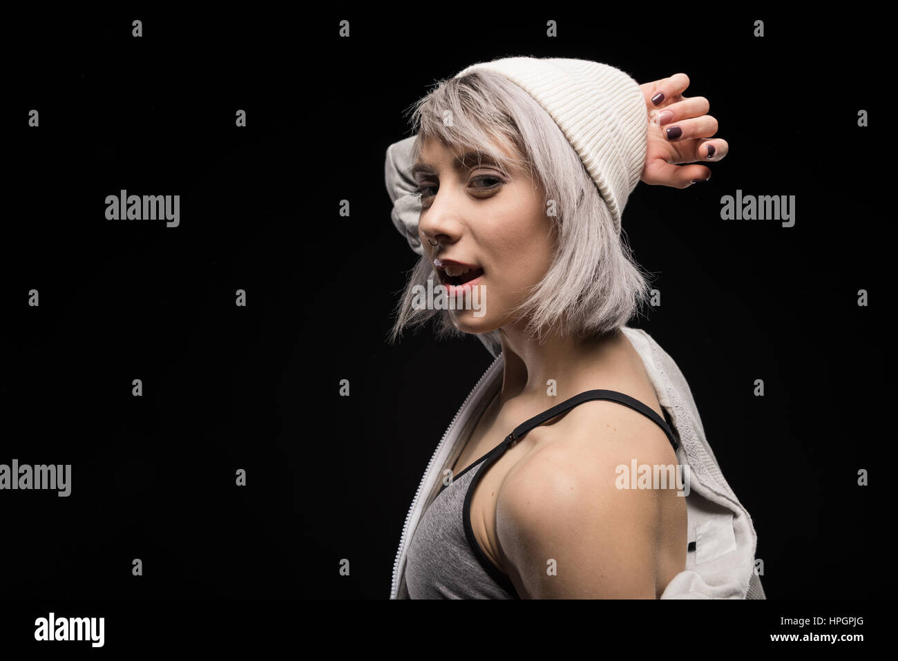skittish woman in sports clothing on black Stock Photo Alamy skittish woman in sports clothing on black Stock Photo Alamy