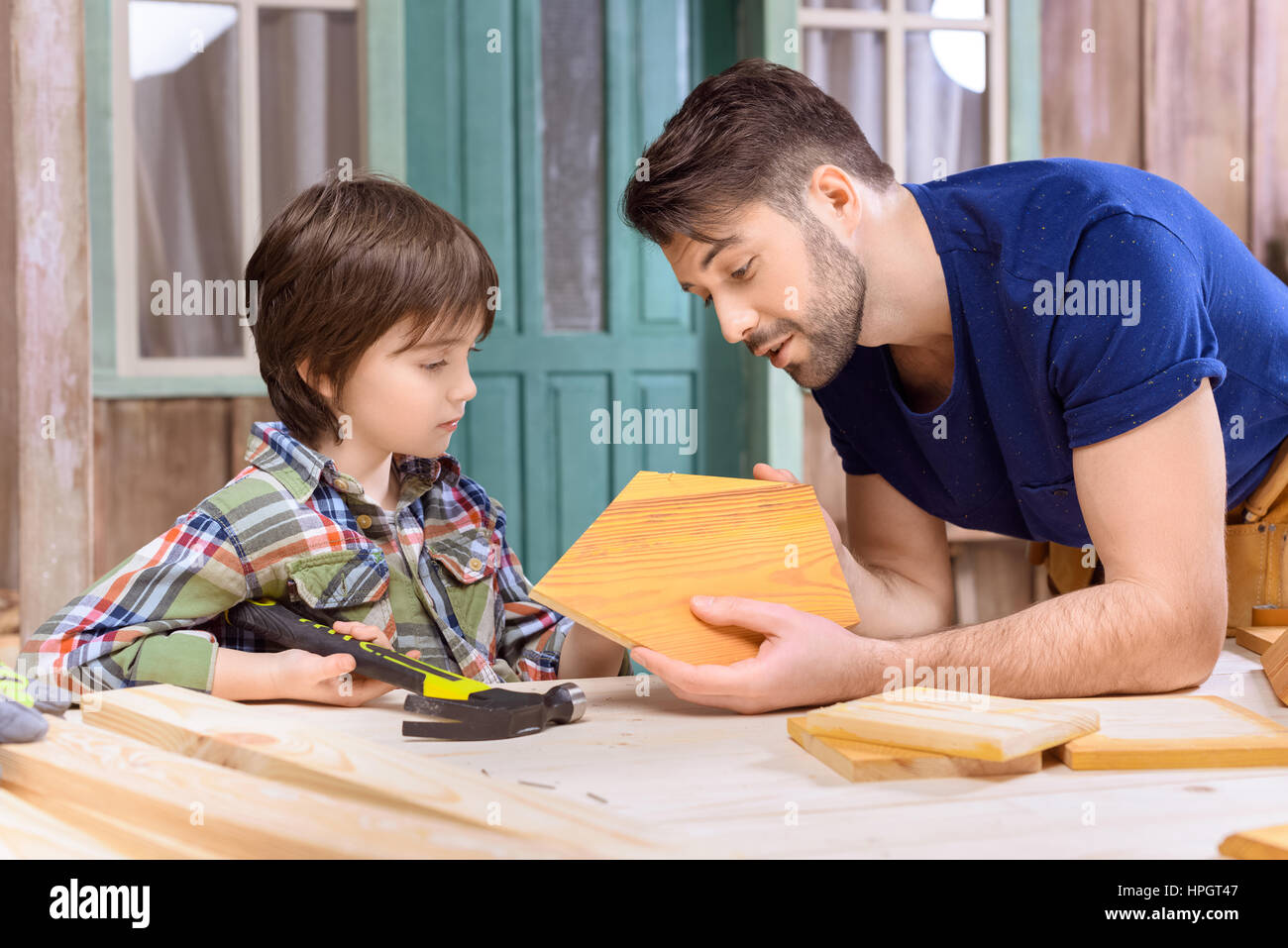 father and son woodworking together in Stock Photo Alamy