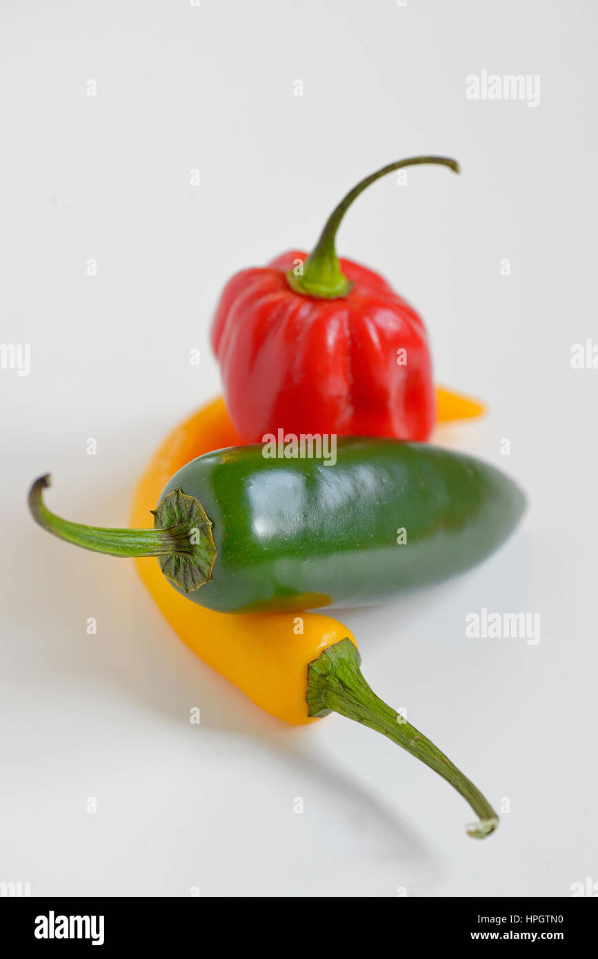 Sweet and Hot Peppers on white background Stock Photo