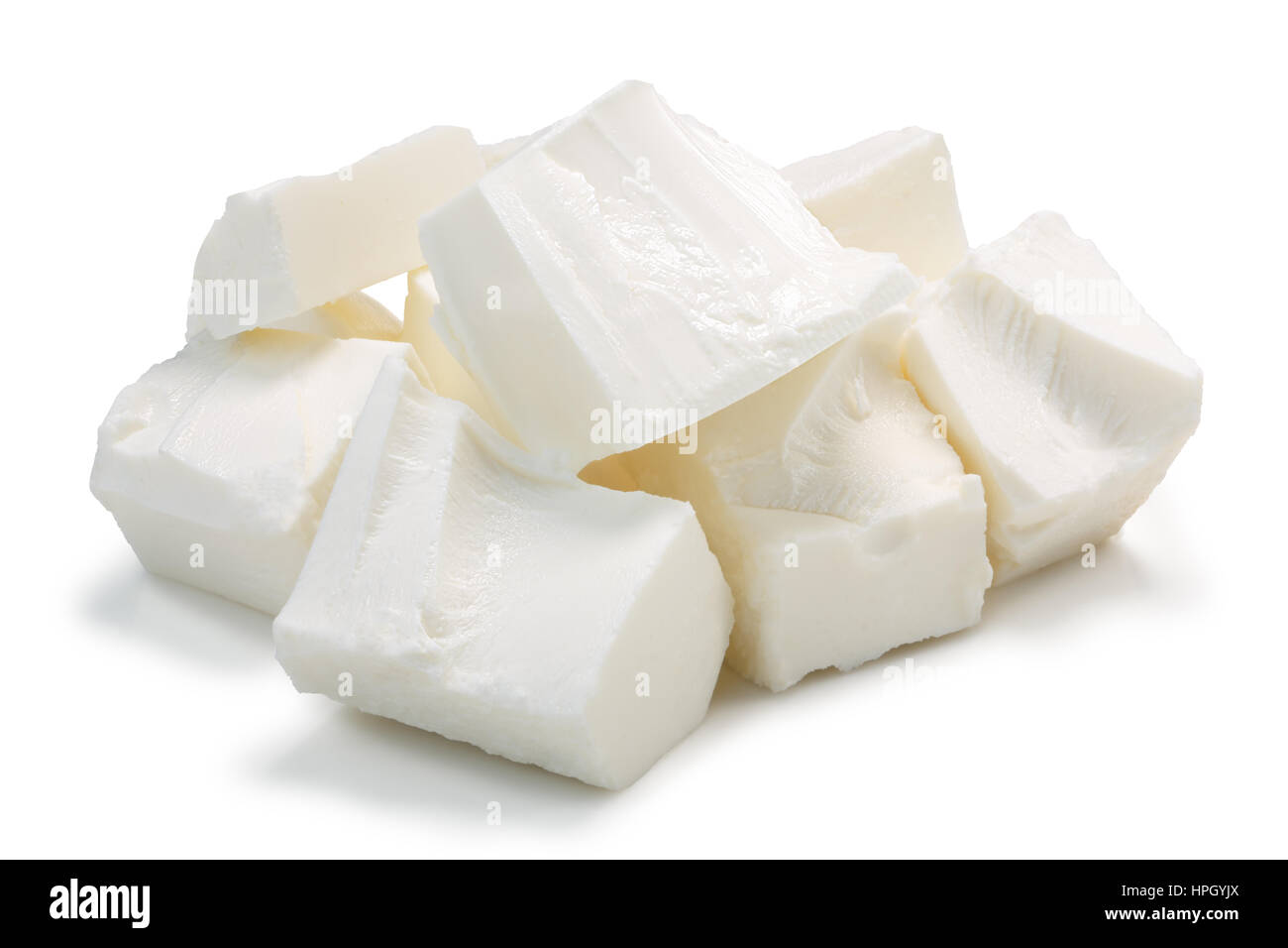 Pile of roughly chopped soft brined Feta cheese. Clipping paths, shadow separated Stock Photo