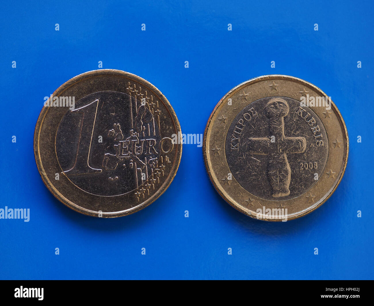 1 euro coin money (EUR), currency of European Union, Cyprus over blue background Stock Photo