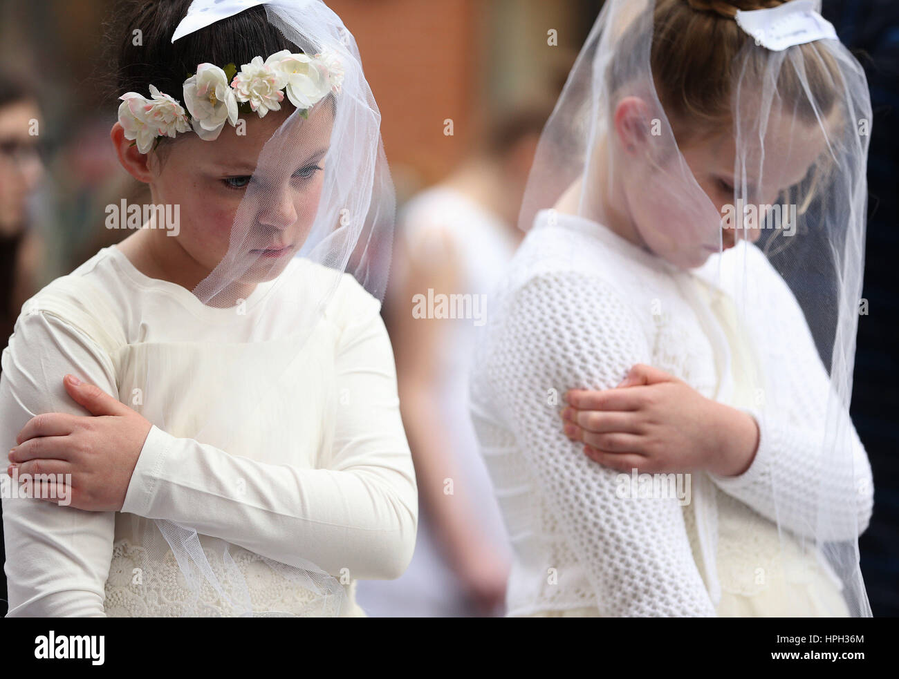 Girls dressed as child brides take part in a 'mannequin challenge' on Dublin's South King Street, organised by child rights organisation Plan International Ireland, to show support for the 16.5 million girls who are globally displaced because of conflict or persecution. Stock Photo