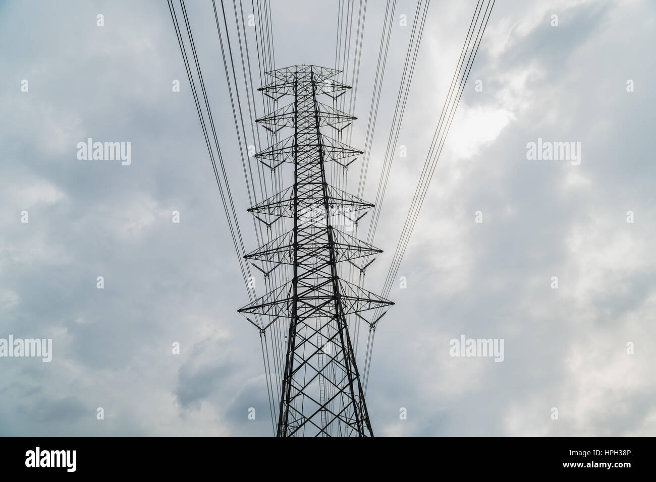 Silhouette of electricity post on blue sky background, low angle shot ...