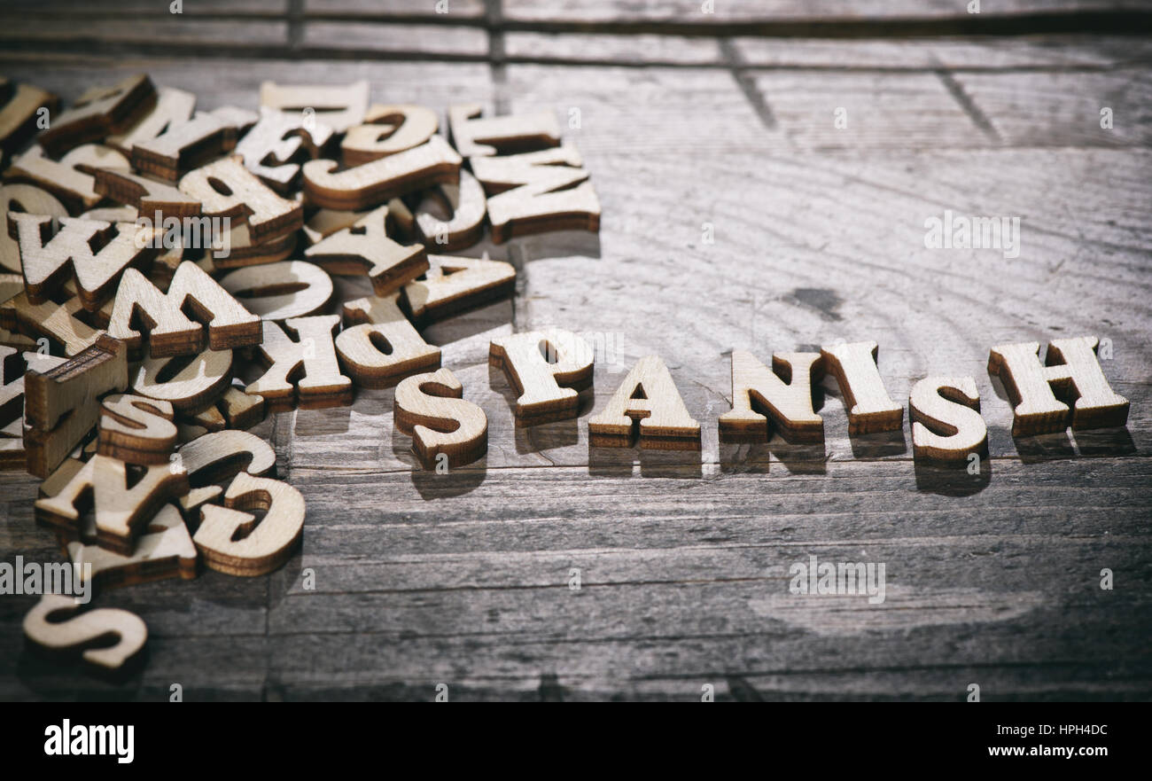 Word spanish made with wooden letters. Learning language concept Stock