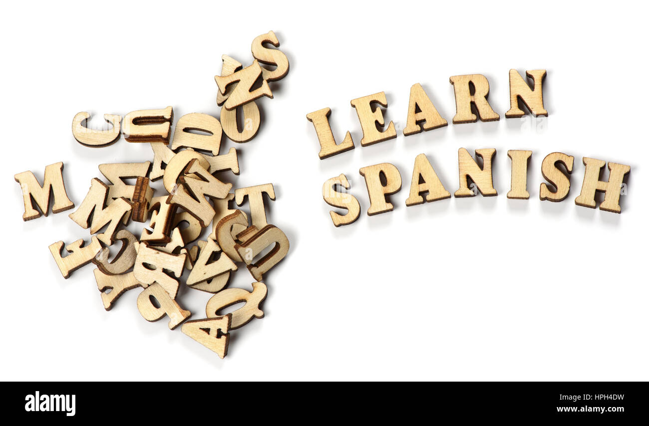 learn spanish concept. wooden letters on a white background Stock Photo