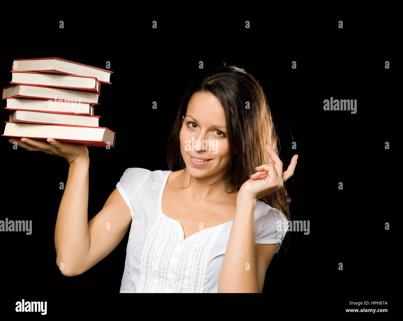 Junge Frau mit Buchstapel - woman with stack of books, Model released Stock Photo