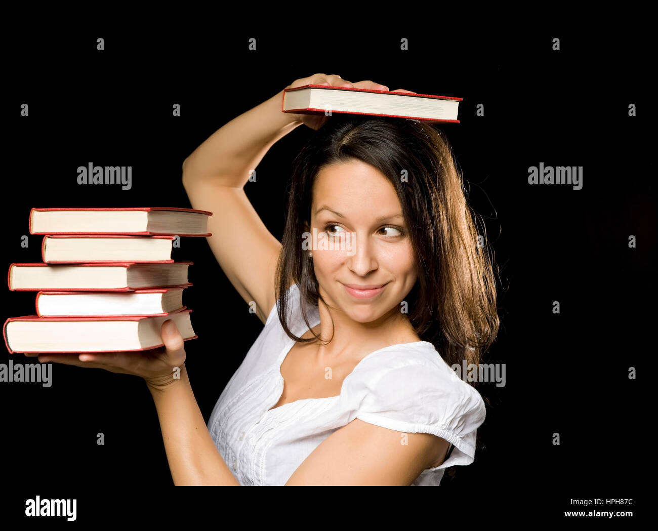 Junge Frau mit Buchstapel - woman with stack of books, Model released Stock Photo