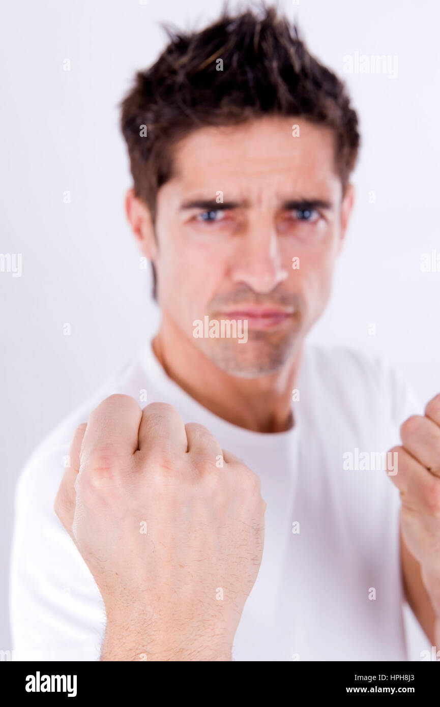 Aggressiver Mann mit geballter Faust - aggressiv man with clenched hand, Model released Stock Photo