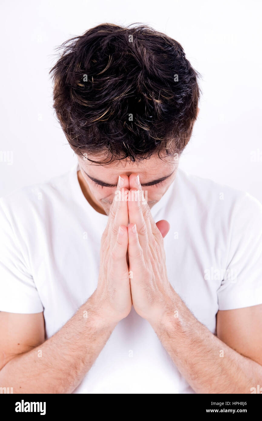 Mann mit gefaltenen Haenden - man praying, Model released Stock Photo