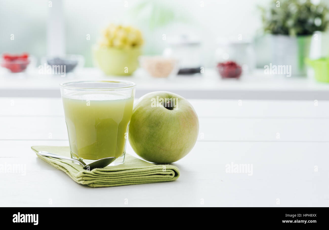 Fresh homemade green apple juice in a glass, detox and healthy ...