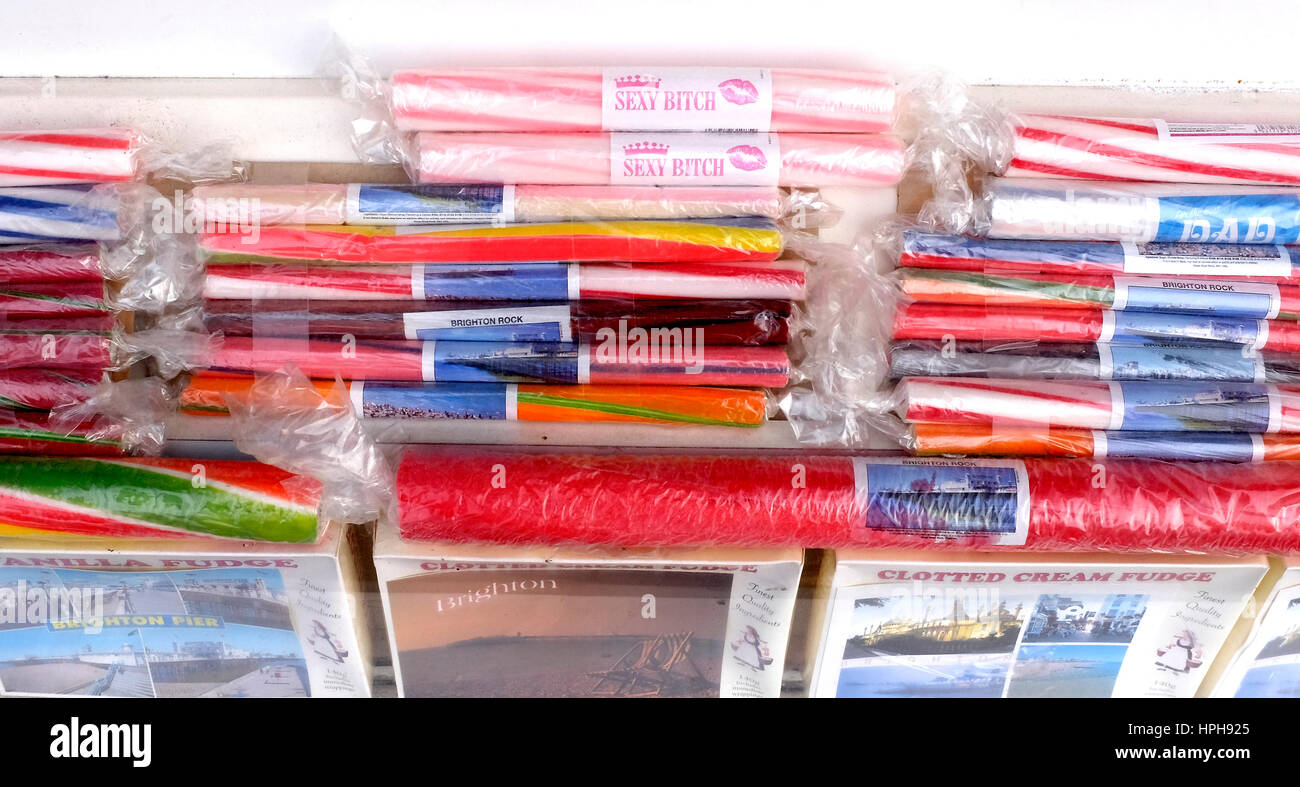 Colourful sticks of rock on sale in Brighton seaside resort gift shop UK Stock Photo