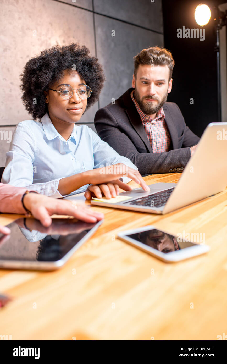 Coworkers working indoors Stock Photo Alamy
