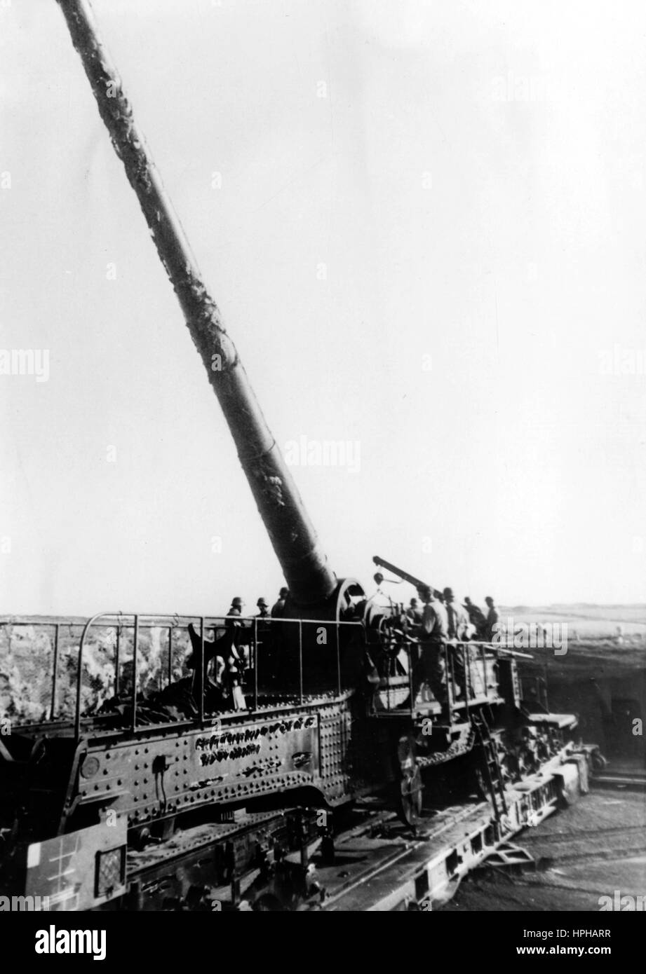 The Nazi propaganda image shows German Wehrmacht soldiers on a heavy rail gun on a base on the Atlantic Wall. Published in June 1943. A Nazi reporter has written on the reverse of the picture on 19.06.1943, 'Giant guns of the most modern construction are stretched along the Atlantic Wall, their cannons aimed at England. They will hurl their state of the art munitions at any attacker and show him how strongly Germany has Europe's western edge protected.' Fotoarchiv für Zeitgeschichte - NO WIRE SERVICE - | usage worldwide Stock Photo