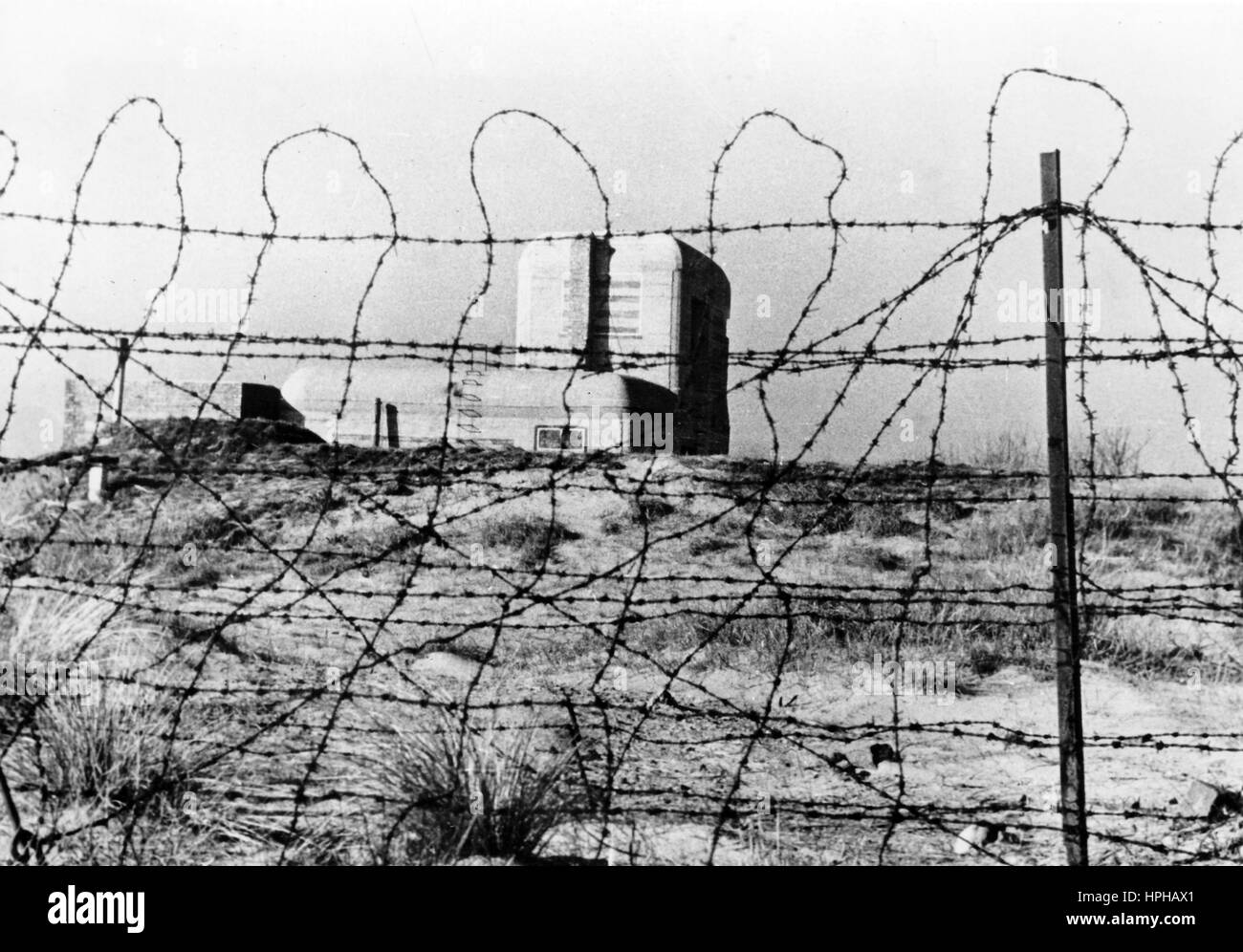 The Nazi propaganda image shows a German Wehrmacht base on the Atlantic Wall. Published in April 1944. A Nazi reporter has written on the reverse of the picture, 'Wired landscape. Bunkers, wire obstacles and tank blockades charachterise the coastal landscape of today. The Atlantic Wall is the defensive line for the European continent armed against every invasion attempt.' Fotoarchiv für Zeitgeschichte - NO WIRE SERVICE - | usage worldwide Stock Photo