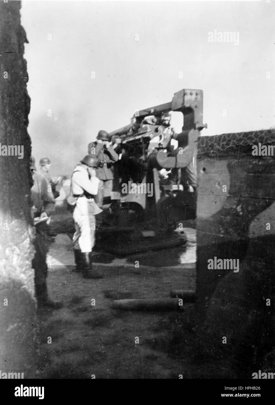 The Nazi propaganda image shows war navy soldiers launching an anti-aircraft gun at an artillery station on the Atlantic Wall in October 1944. A Nazi reporter has written on the reverse of the picture on 17.10.1944, 'Naval flak in ground combat. An anti-aircraft war navy battery, heroically defending German bases on the Channel and the Atlantic, and engaging in ground combat. Despite the numerical superiority of the Anglo-American side in terms of troops, weapons and materials, these bases have been holding back the assault for weeks.' Fotoarchiv für Zeitgeschichte - NO WIRELESS SERVICE - | Stock Photo