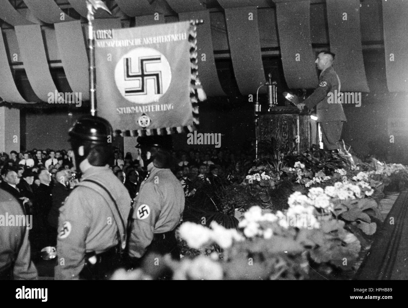 The Nazi propaganda shows the chief of civil affairs, Gustav Simon, during his address at the first National Socialist rally in Luxembourg (city) on 28.09.1940. The Nazi propaganda on the reverse of the picture reads, 'Mass rally in Luxembourg. On Saturday, Luxembourg, the main city of the former Grand Duchy, experienced its first National Socialist mass rally, at which chief of civil affairs, district leader and State Councillor Gustav Simon gave an address. - District leader Simon during his address.' Fotoarchiv für Zeitgeschichte - NO WIRE SERVICE - | usage worldwide Stock Photo