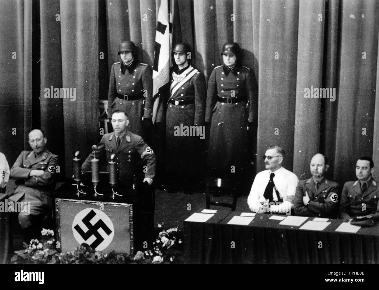 The Nazi propaganda period shows the Chief of Civil Affairs Gustav Simon during his address at a Volksdeutsche Bewegung (VdB) (German People's Movement) rally in Luxembourg (city) on 05.01.1941. The Nazi propaganda on the reverse of the movement reads, 'First roll call of the now more than 50,000 members of the German People's Movement takes place, at which the Chief of Civil Affairs, district leader Gustav Simon, gave the the rally crying.' Fotoarchiv für Zeitgeschichte - NO WIRE SERVICE - | usage worldwide Stock Photo