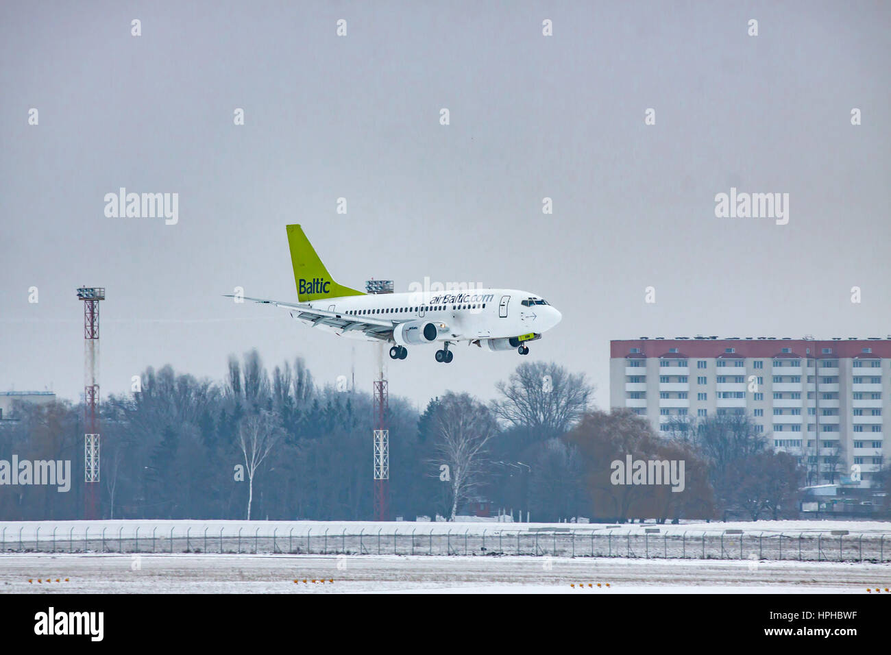 Borispol, Ukraine - January 6, 2011: airBaltic Boeing 737 passenger plane landing on a winter day Stock Photo