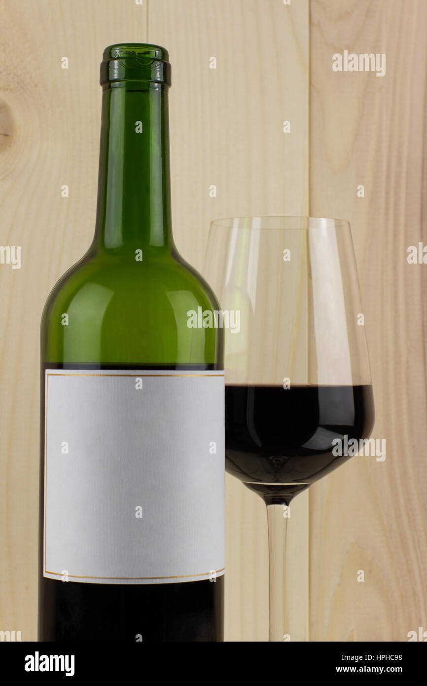 bottle of red wine with a brilliant glass on a Stock Photo