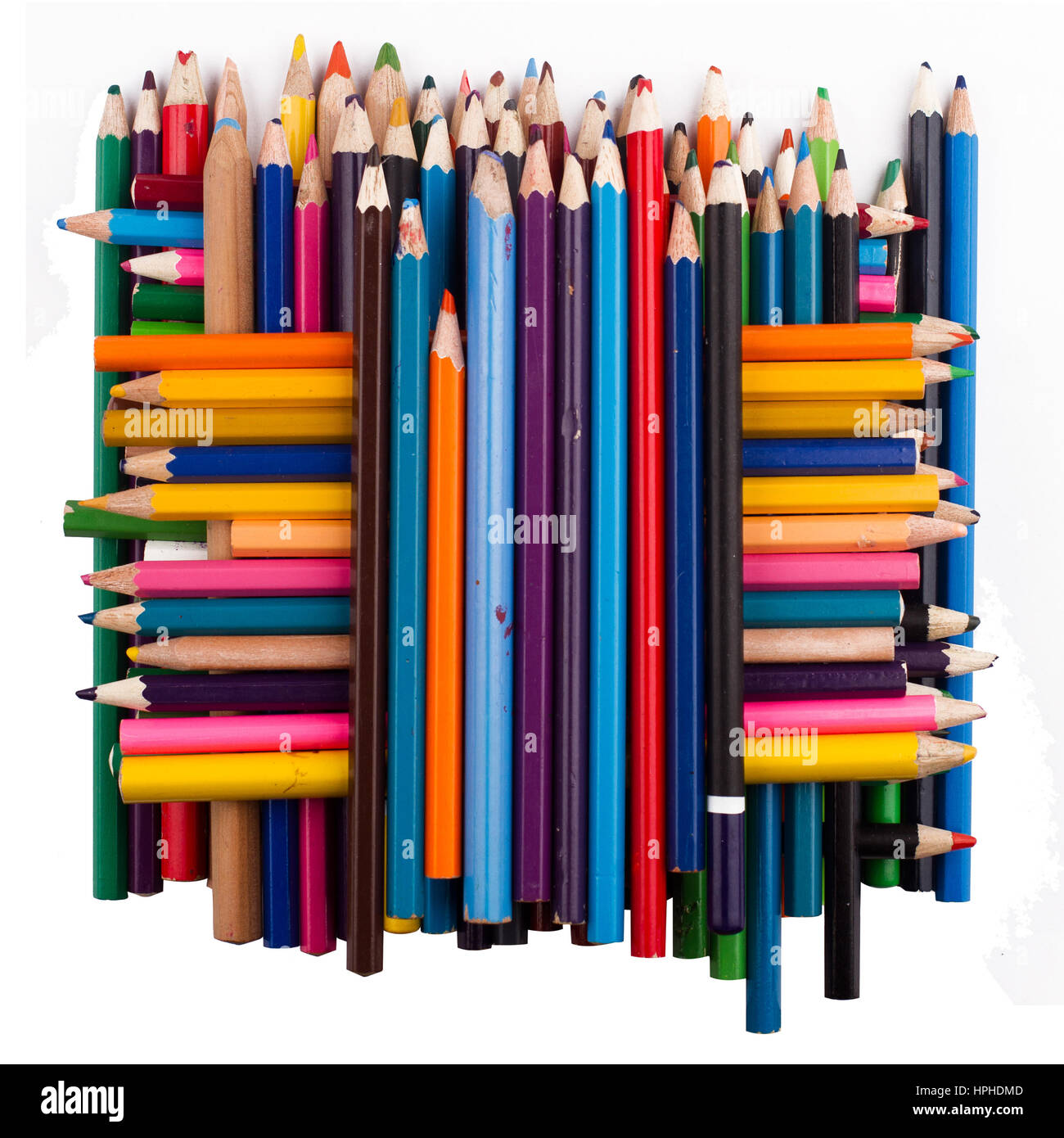 Top view of many colored pencils arranged in a pile on top of each