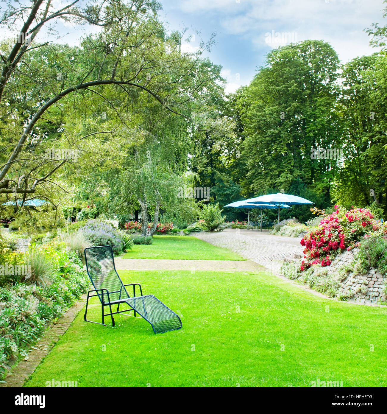beautiful summer park with green lawns and flower beds Stock Photo - Alamy