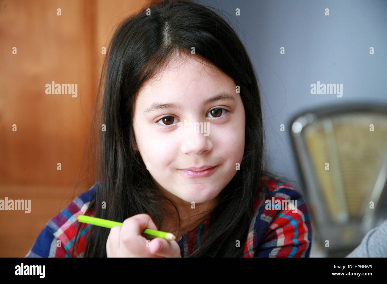 young girl smiling at camera Stock Photo - Alamy
